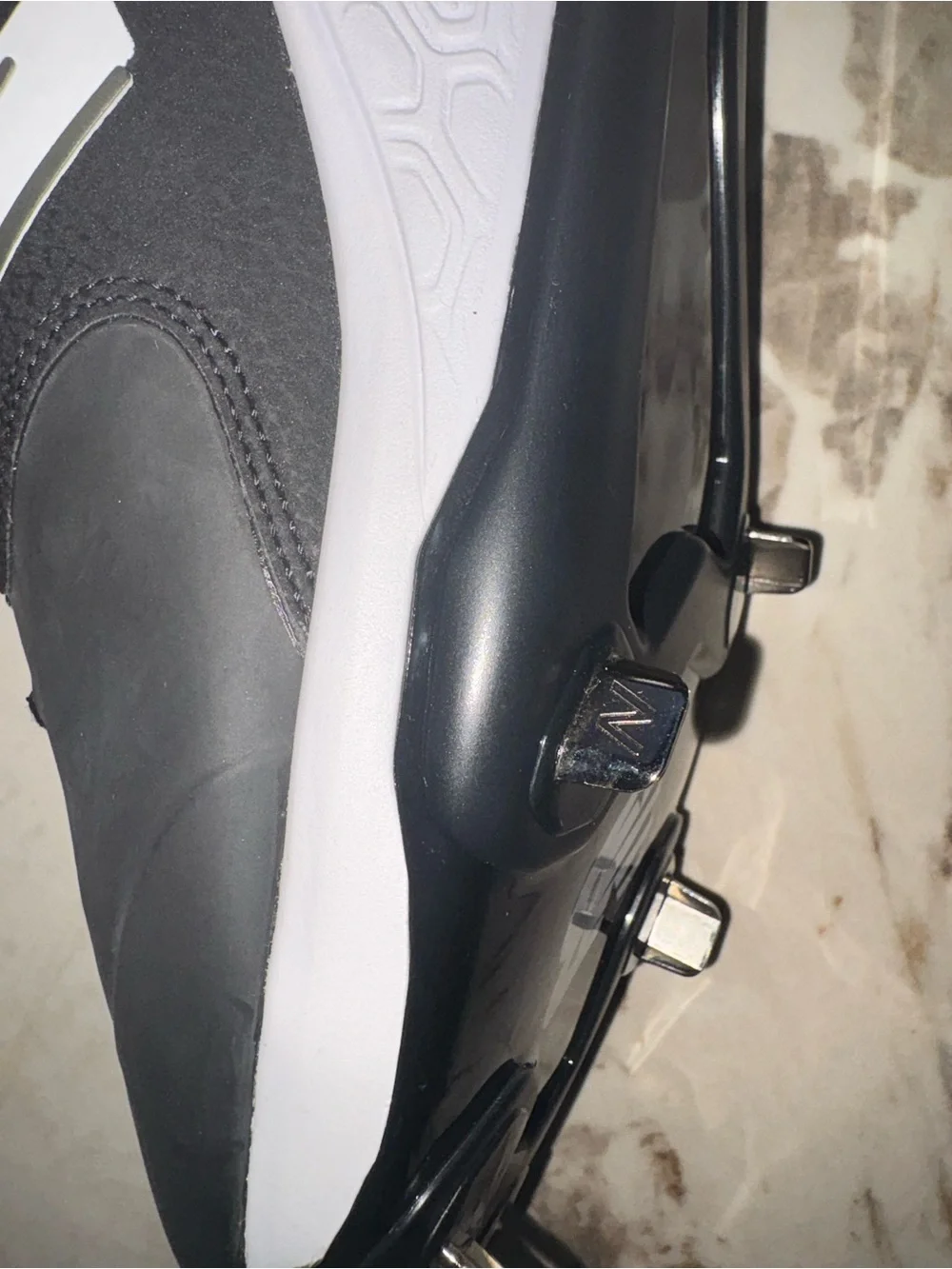 New Balance Men’s Black and White Baseball Cleats with Metal Spikes